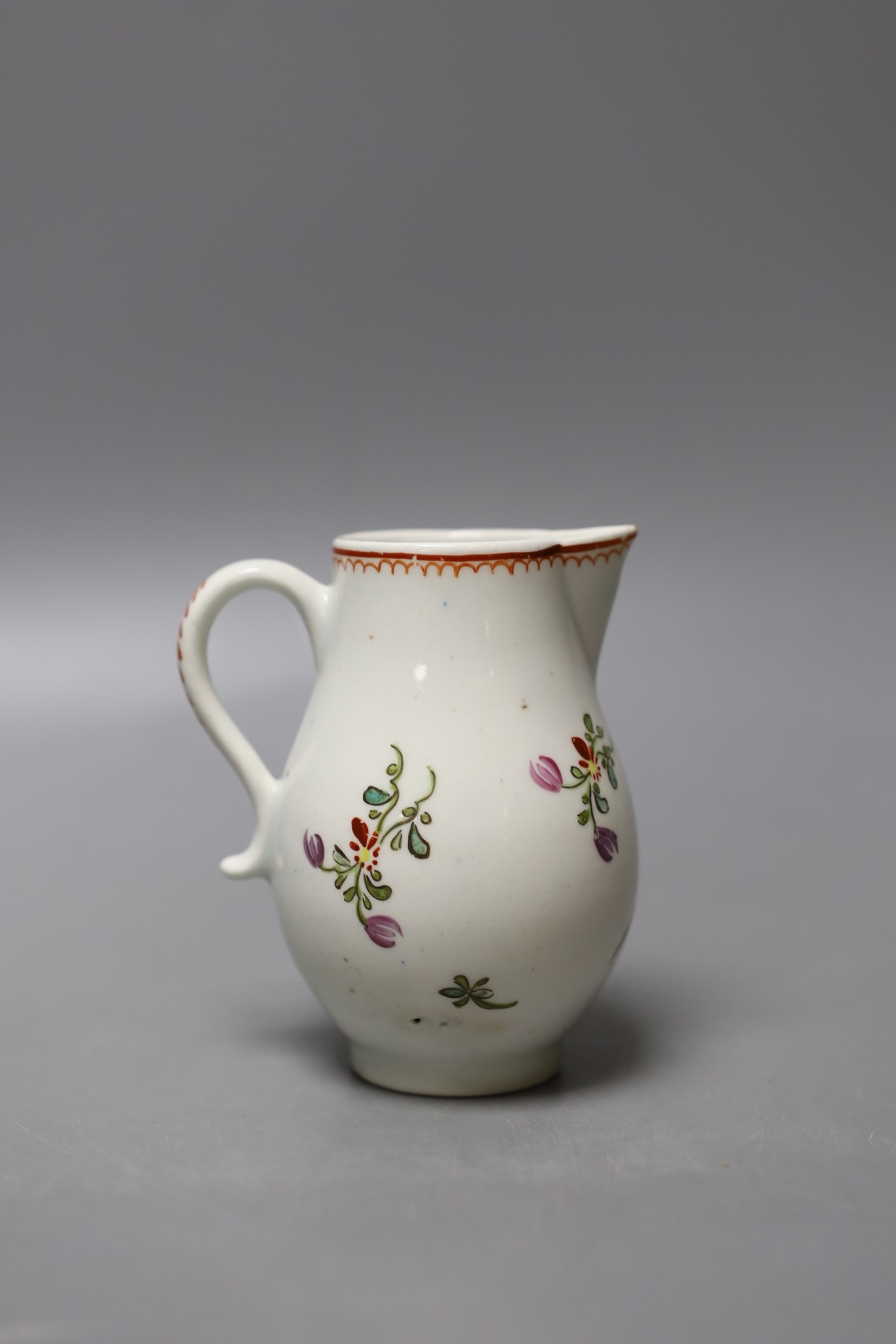 Lowestoft sparrow beak jug painted with a floral spray and scattered sprigs c.1780 - 9.5cm high
